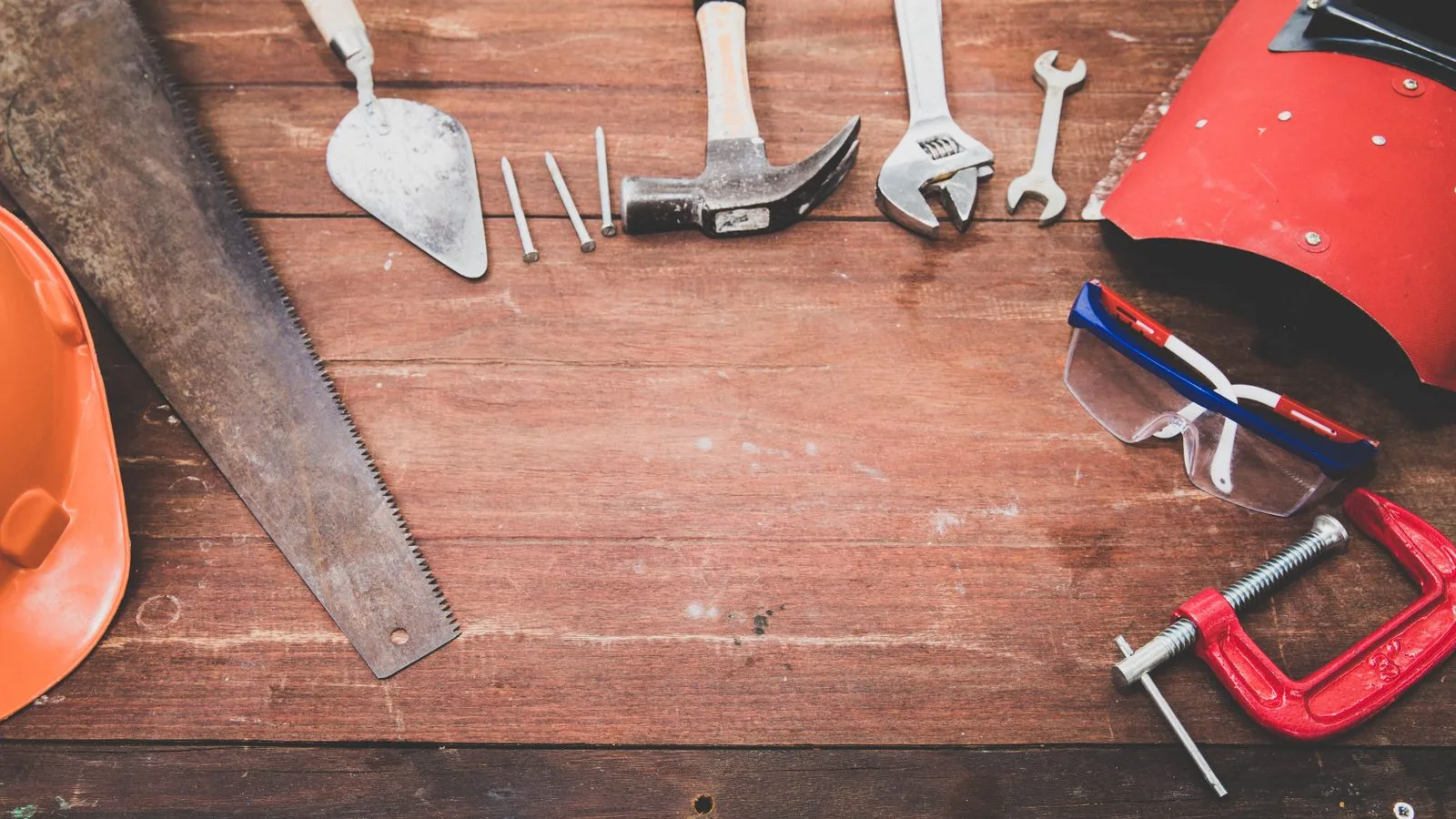 A flat lay of professional hand tools on a workbench