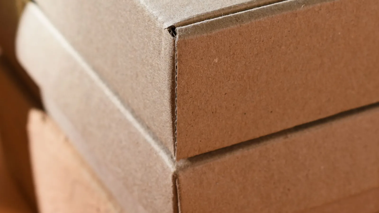Unbranded cardboard packaging boxes stacked together