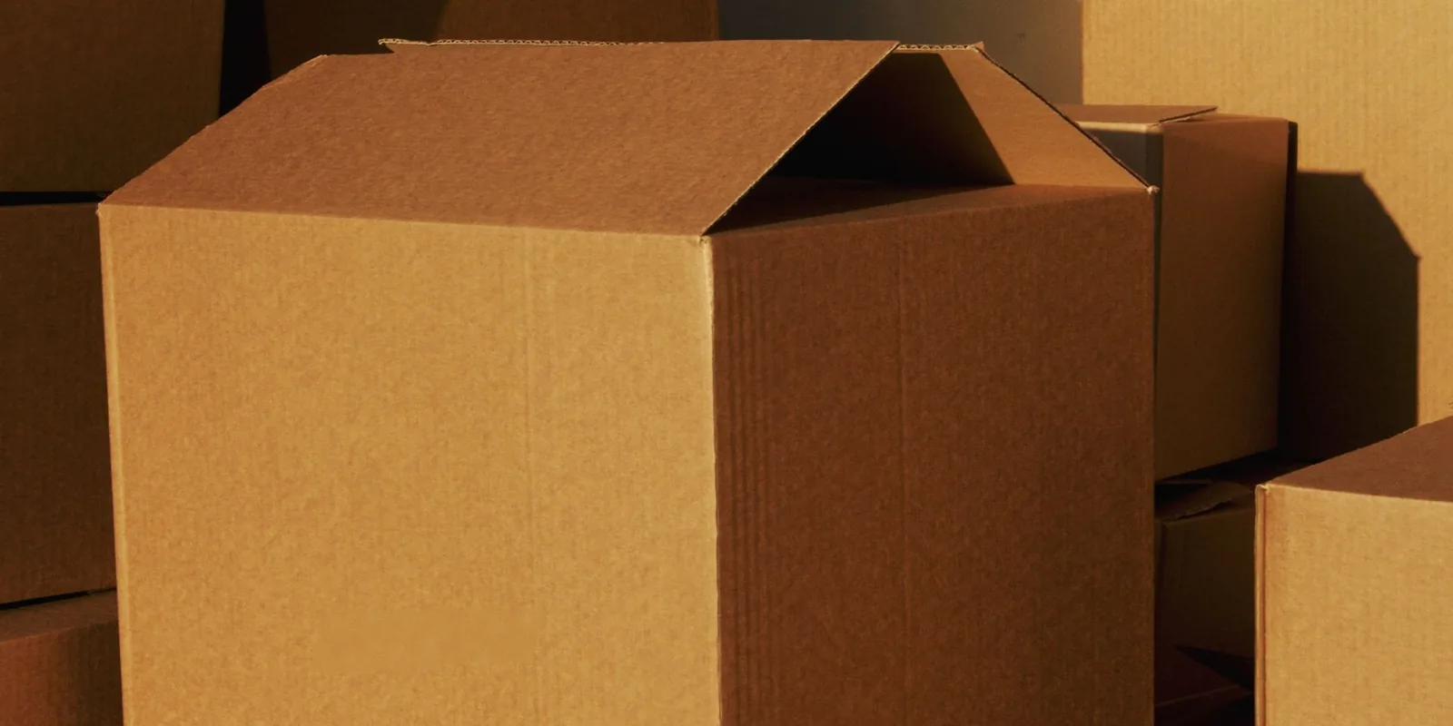 Plain cardboard shipping boxes prepared for packing